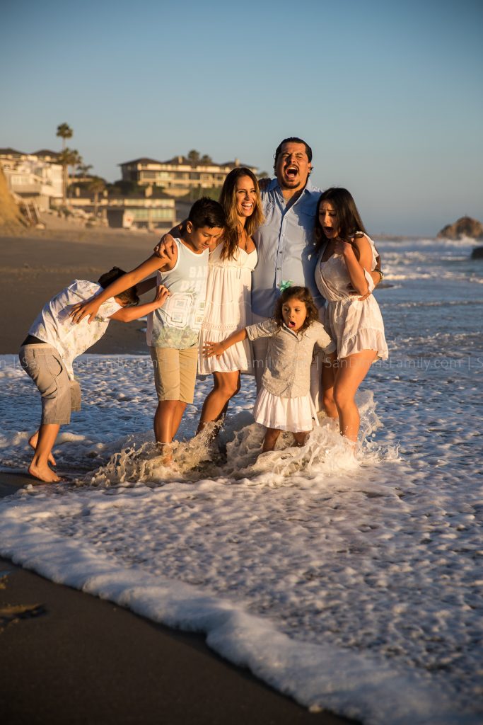 Beach Family Photo Blooper gets hit by Ocean Wave